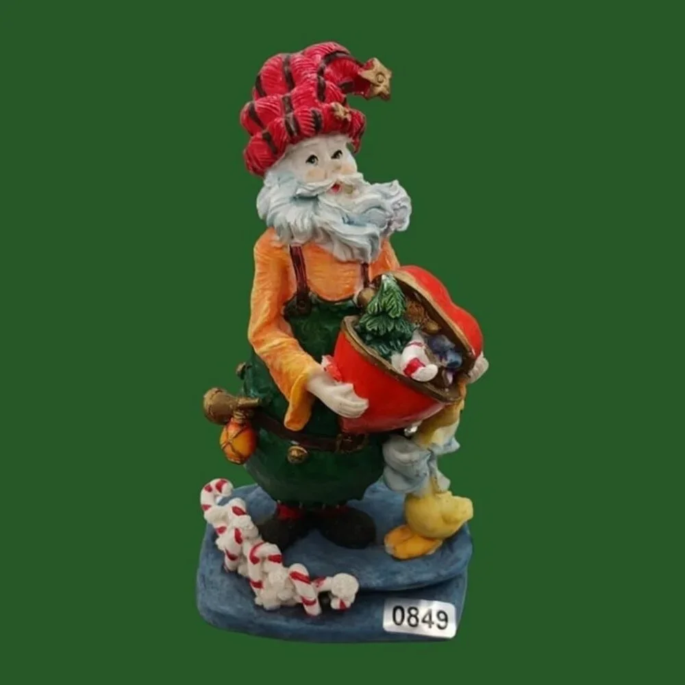 Santa claus figurine with gift and duck
